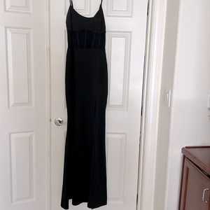 Long black dress with sexy sheer open front.